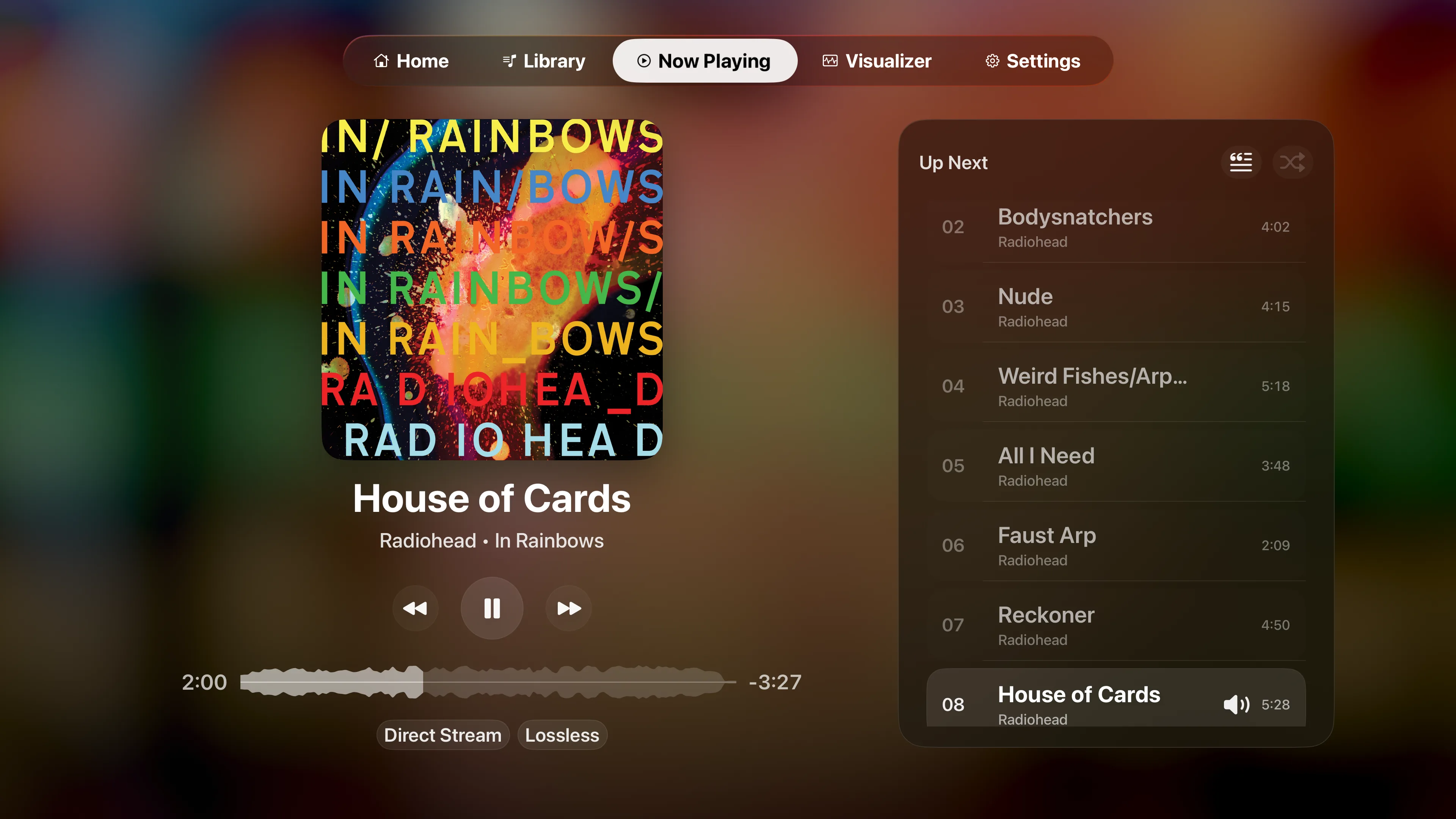 Now Playing in Playris on Apple TV: In Rainbows by Radiohead, with Up Next beside it